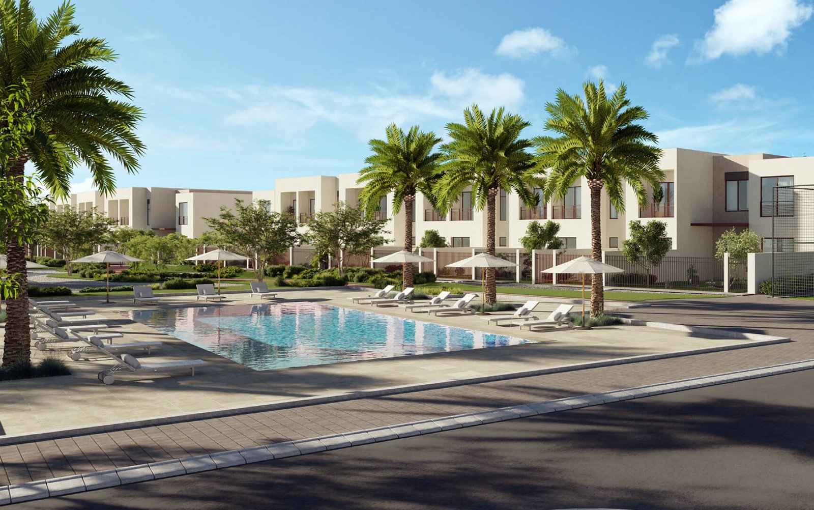 Community pool view with palm trees at Granada II